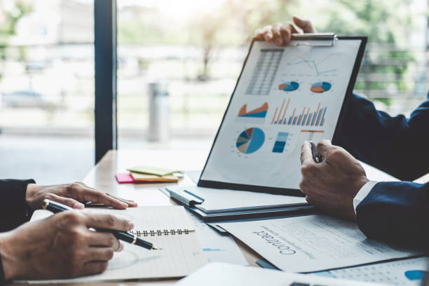 istock Finance manager meeting discussing company growth project success financial statistics, professional investor working start up project for strategy plan with document, laptop and digital tablet 1076517748