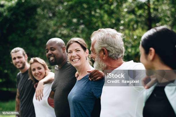 Happy Diverse People Together In The Park Stock Photo - Download Image Now - Group Of People, Community, Multiracial Group