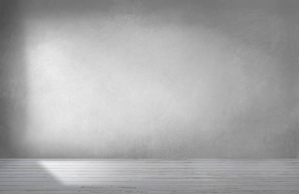 istock Gray wall in an empty room with concrete floor 1076519214