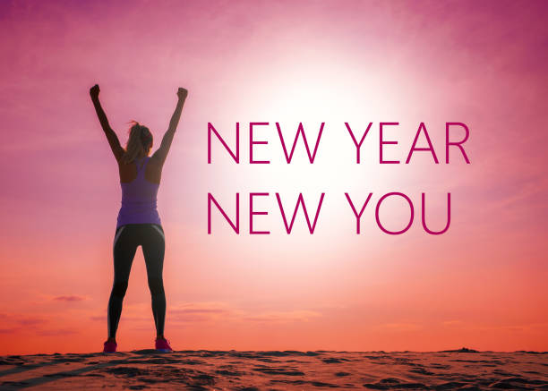 New year new you text quote on the image of womans silhouette at sunrise. New year new you text quote on the image of unrecognizable woman's silhouette at sunrise. new year new life stock pictures, royalty-free photos & images