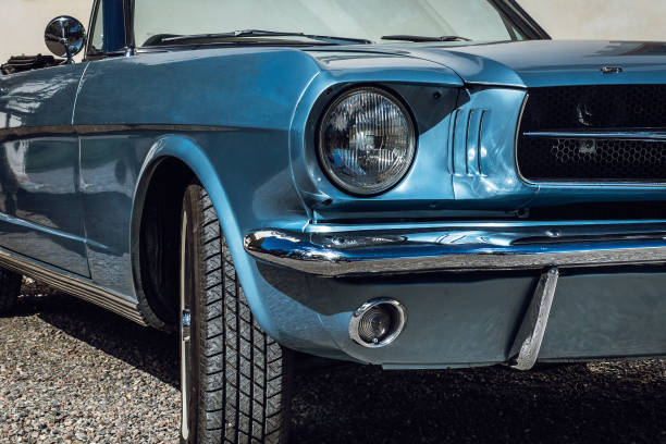 Classic American car from the sixties Partial close up of a light blue metallic colored classic car from the sixties shining in bright sunshine vintage car photos stock pictures, royalty-free photos & images