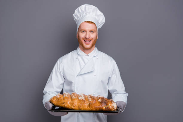 istock Glad cheerful grinning careless carefree chef stand isolated on 1076527072