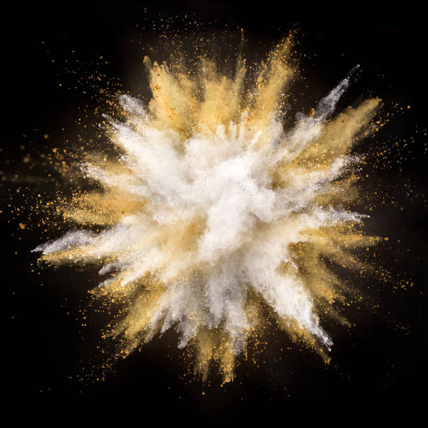 istock Silver and gold powder explosion on black background. 1076532938