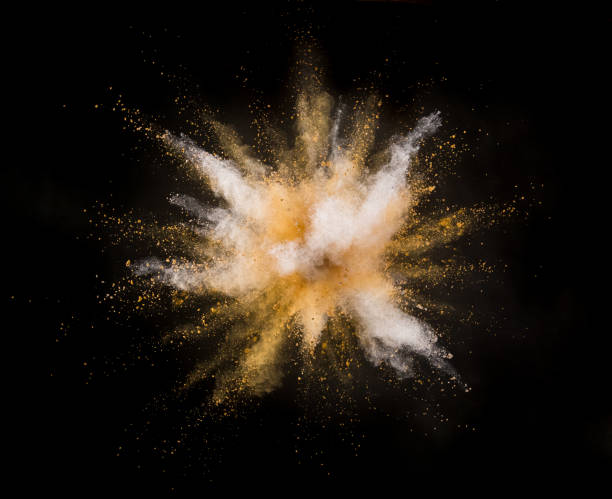 istock Silver and gold powder explosion on black background. 1076532948