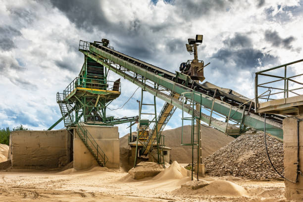 istock Excavator collecting stone in an open-cast mine 1076535724