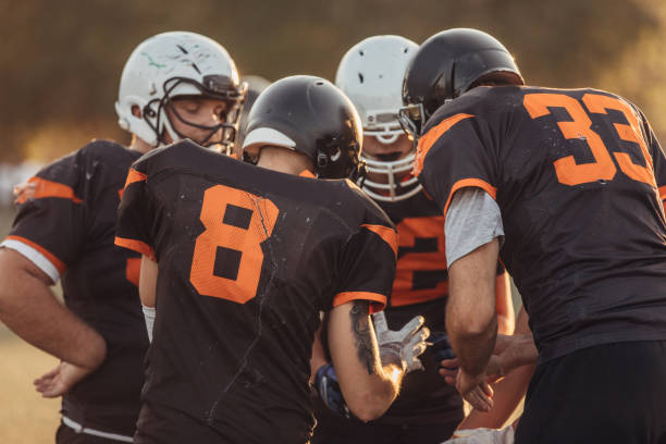 istock Football players on time out 1076537840