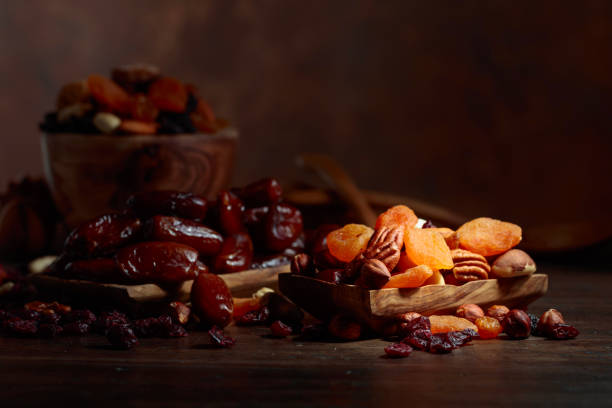 istock Various dried fruits and nuts in wooden dish. 1076550042