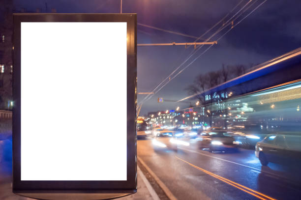 istock Blank lightbox at night with car lights in motion blur 1076566978