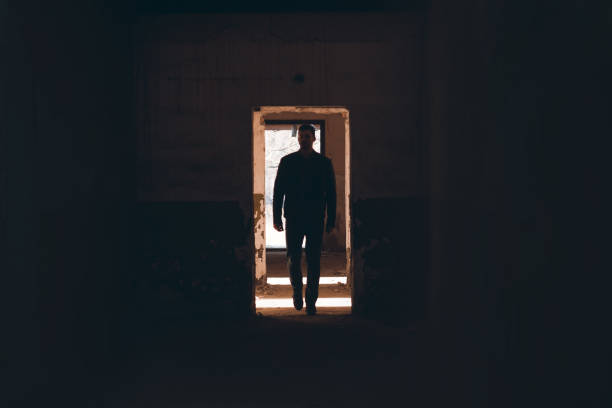 istock Handsome Man walk thru the Empty Factory 1076570780