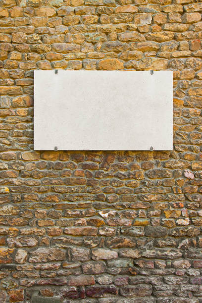 istock Blank marble plaque on italian stone wall 1076574388