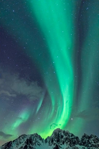 istock Northern Lights background image with mountain peaks and Aurora 1076574474