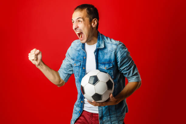 Fan / Sport Player celebrating on red background