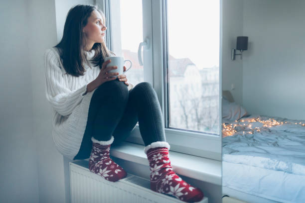 istock Sad woman at home 1076578364