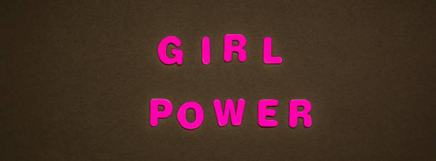 istock GIRL POWER writing on black paper background 1076582434