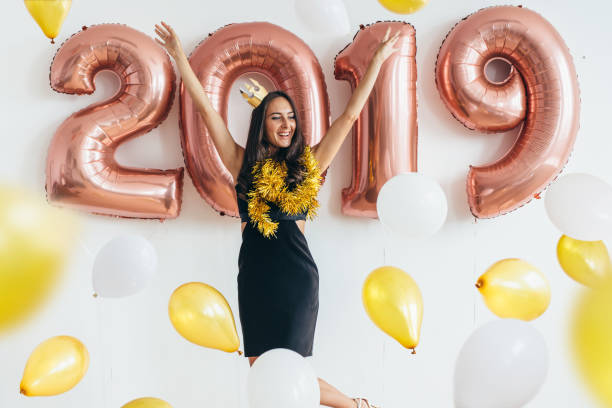 istock Girl posing with balloons Playing and celebrating 1076583608