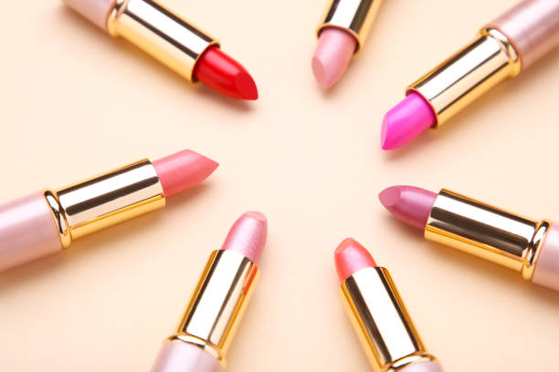 istock Many colorful lipstick on beige background, flat lay 1076591238