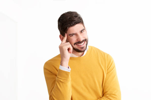 istock Laughing young man studio portrait at isolated white background 1076592018