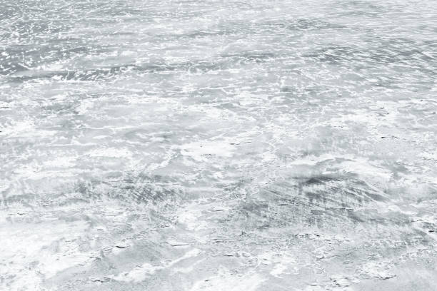 istock Ice rink covered with show on frozen river 1076593636