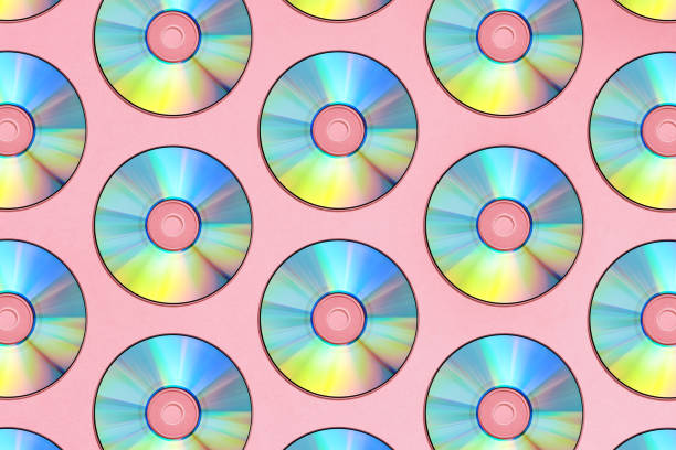 CD Background Compact discs on a pink background compact disc stock pictures, royalty-free photos & images