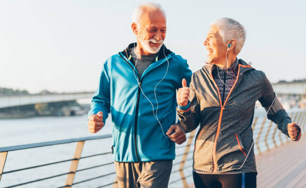 istock Senior couple jogging together 1076596714