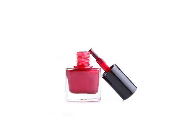 istock Red nail polish bottle isolated on white background 1076599888