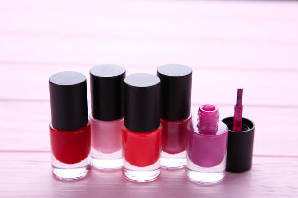 istock Group of bright nail polishes on pink 1076600292