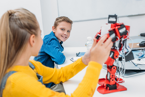 Technology Class Kids Schoolchildren Programming Robot Together During Stem Educational Class ...