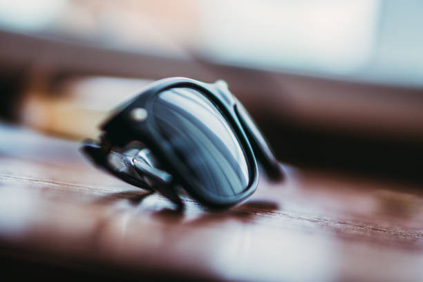 istock Sunglasses. Sunglasses are on the table 1076605410
