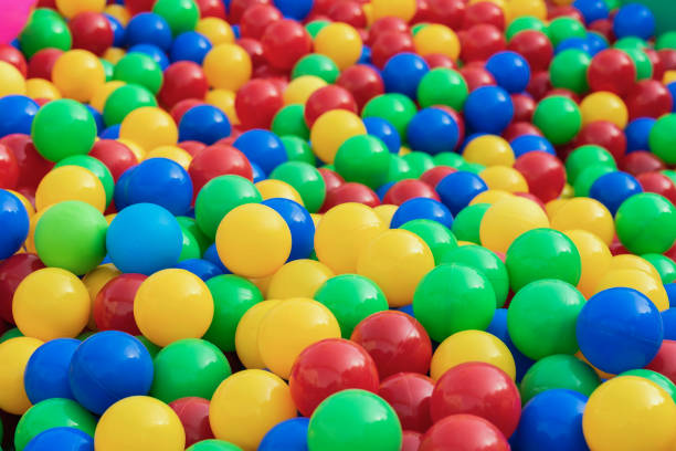 istock Colorful plastic multi-colored balls, bright background for children's themes and events 1076607318