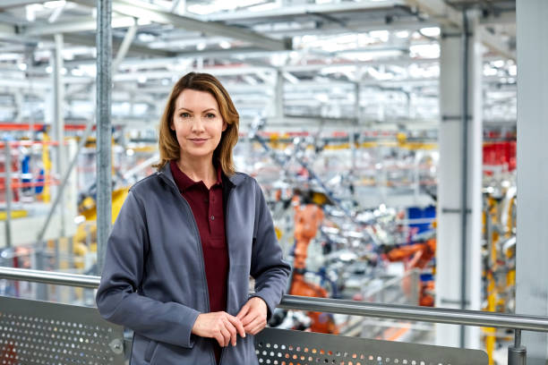 Female engineer standing in automobile industry