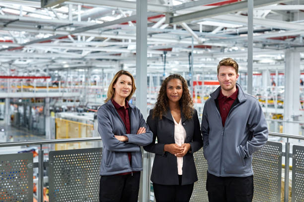istock Confident manager and engineers in car plant 1076609448