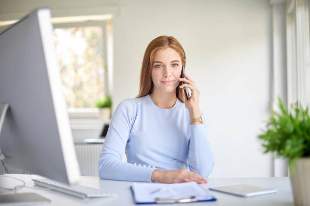 istock Businesswoman using her cell phone 1076612212