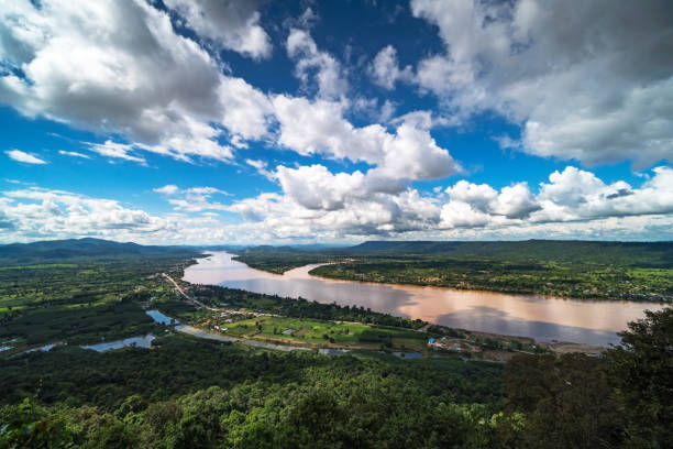 Mekong River At Nong Khai In Thailand Mekong River At Nong Khai In Thailand, high angle view of landscape with cumulus clouds nong khai province stock pictures, royalty-free photos & images