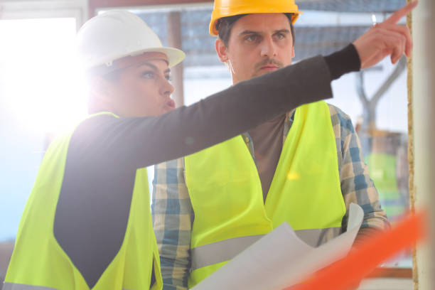 istock Male and female worker on construction site 1076613672