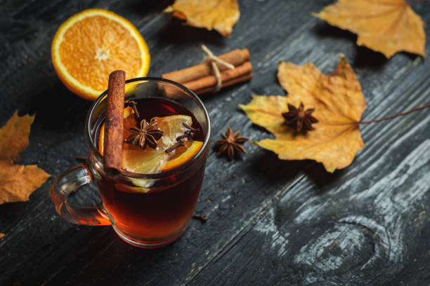istock Hot mulled wine on a dark wooden table close-up 1076616944