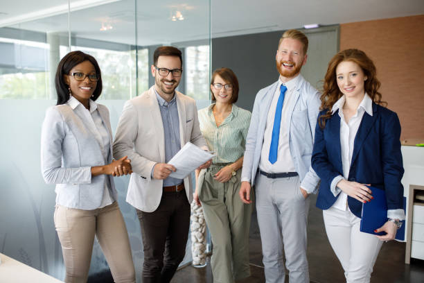 istock Group portrait of successful office team at work 1076617022