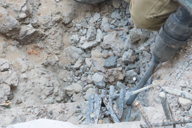 istock Worker use demolish tool for concrete surface and then make finishing concrete surface in construction job site 1076620712
