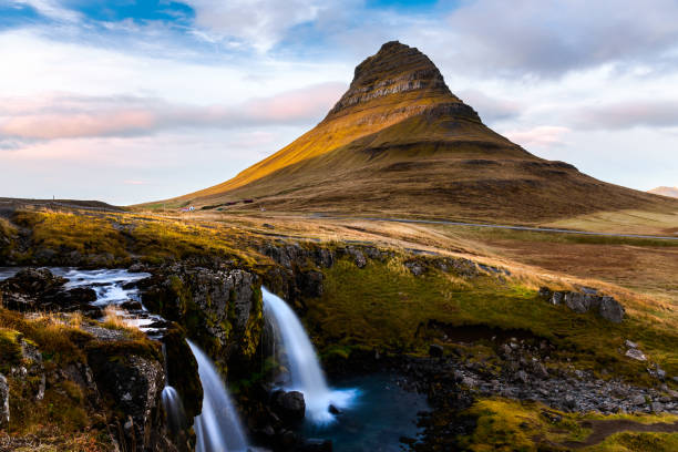 istock Waterfall with a Mountain in Background in Iceland in Autumn 1076626428