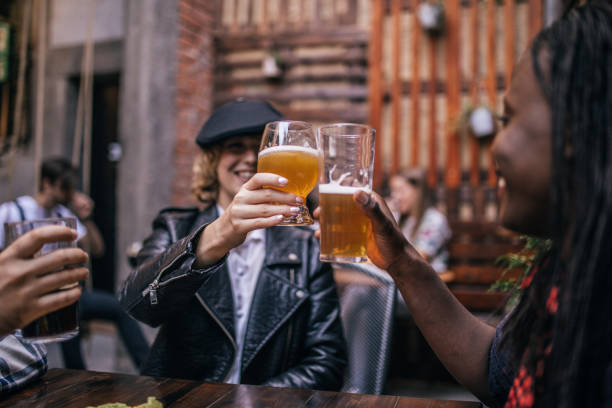 istock Women celebrating in pub 1076626750