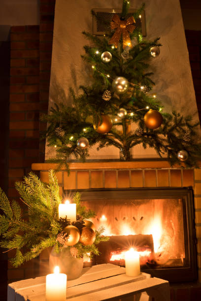 istock Christmas floral decoration in front of firepace. 1076631700