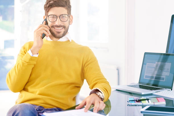 istock Businessman using mobile phone in the office and talking with somebody 1076632484