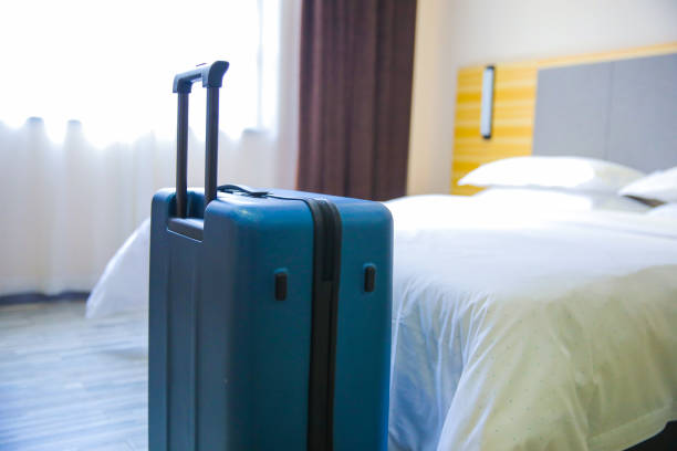 istock Suitcase In Hotel Room 1076634572