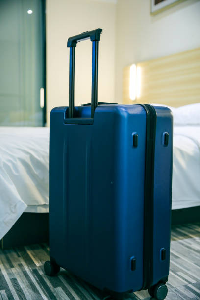 istock Suitcase In Hotel Room 1076634580