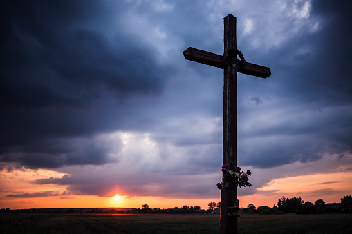 The crucifix with the sunset in the background