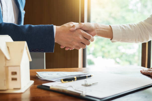 istock High Angle View Of Business People Shaking Hands Over On Table 1076642452