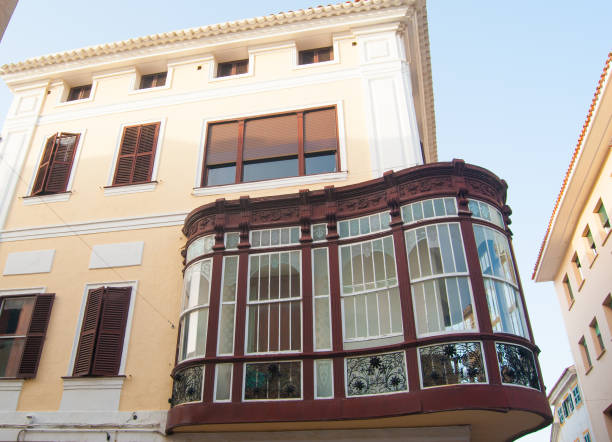 Particular house with curved and covered balcony in the capital of the island of Menorca