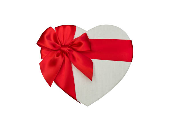 istock heart shaped gift box and red satin ribbon isolated on white background. 1076644612
