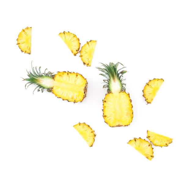 istock Tropical fruit concept. Sliced pineapple isolated on white background. Flat lay, top view. 1076655074