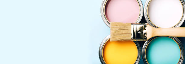 Banner. Brush opened pastel cans on blue background.