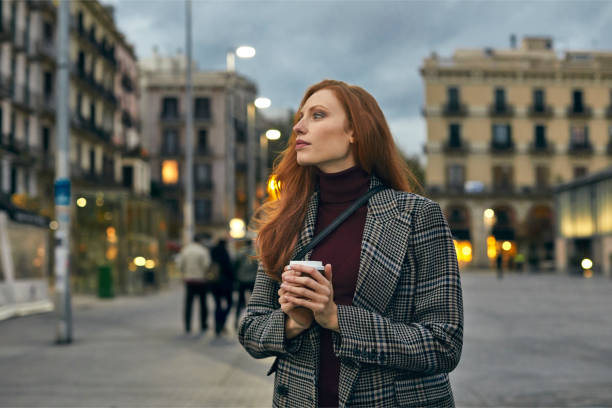 istock Thoughtful women with coffee cup looking away 1076657318